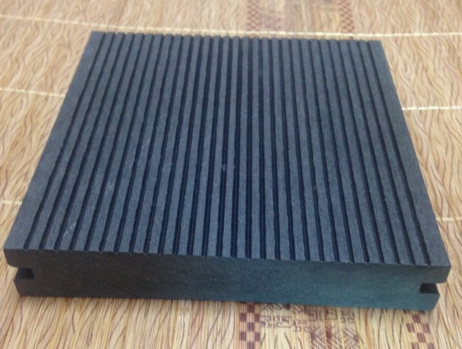 Solid composite decking board